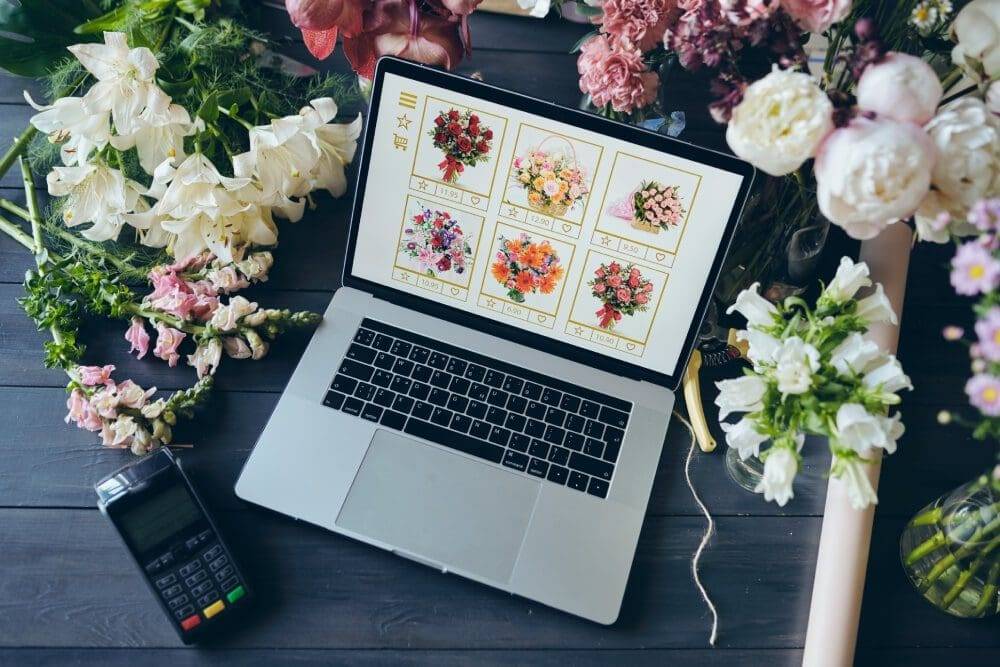 above-view-of-open-laptop-with-flower-shop-website-CMNLAX5